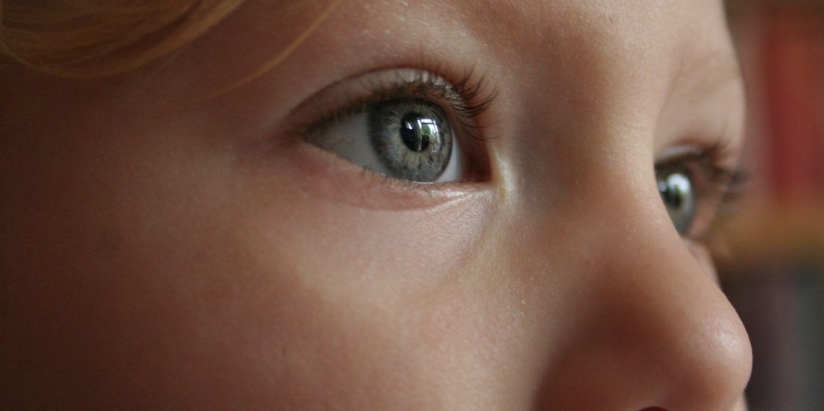 close up of a female child's blue eyes