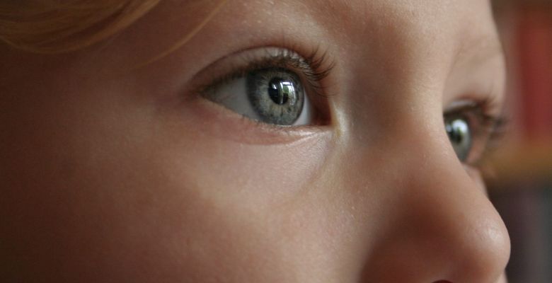 close up of a female child's blue eyes