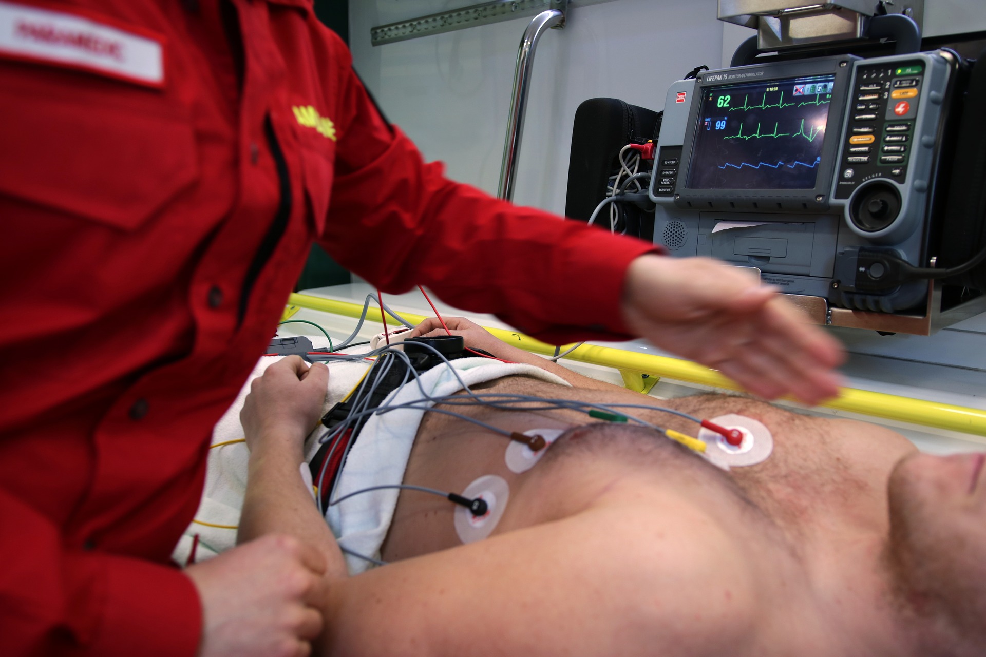 paramedic treats patient in ambulance