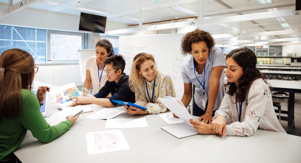Lab and support staff hold a meeting
